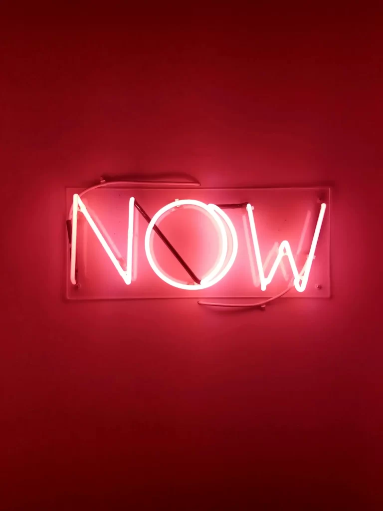 Pink Neon Now Sign